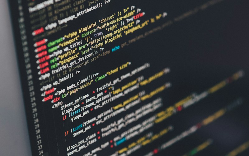 Software engineer writing code on a computer screen